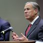 Texas Gov. Greg Abbott speaks before he signs Texas SB 576, an anti-smuggling bill that enhances the criminal penalty for human smuggling when a payment is involved, at McAllen City Hall on Wednesday, Sept. 22, 2021, in McAllen, Texas. (Joel Marinez/The Monitor via AP)