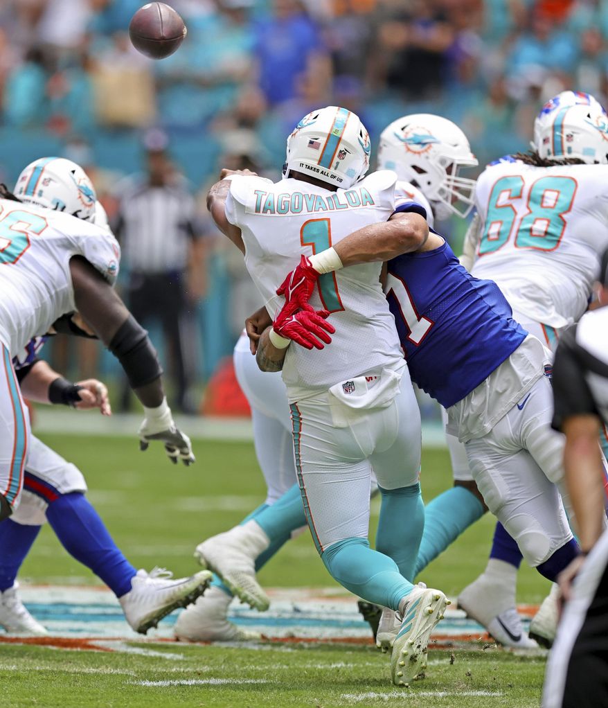 Miami Dolphins quarterback Tua Tagovailoa (1) is sacked by Buffalo Bills defensive end A.J. Epenesa (57) during the first quarter of an NFL football game Sunday, Sept. 19, 2021, in Miami Gardens, Fla. A battery of tests run on Tagovailoa failed to show any serious problems other than bruised ribs, raising at least the possibility that he could play next weekend when the Dolphins (1-1) visit the Las Vegas Raiders (2-0). (David Santiago/Miami Herald via AP) **FILE**