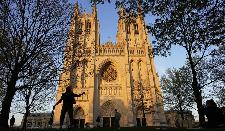 This Tuesday, April 13, 2021, photo shows the Washington National Cathedral in Washington, D.C., at sunset. (AP Photo/Carolyn Kaster) ** FILE **