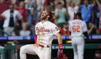 Philadelphia Phillies&#39; Bryce Harper celebrates after scoring the game-winning run on a two-run triple by J.T. Realmuto during the 10th inning of an interleague baseball game against the Baltimore Orioles, Tuesday, Sept. 21, 2021, in Philadelphia. (AP Photo/Matt Slocum) **FILE**
