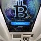 In this Feb. 9, 2021, file photo, the Bitcoin logo appears on the display screen of a cryptocurrency ATM at the Smoker&#39;s Choice store in Salem, N.H.  (AP Photo/Charles Krupa, File) 
 **FILE**