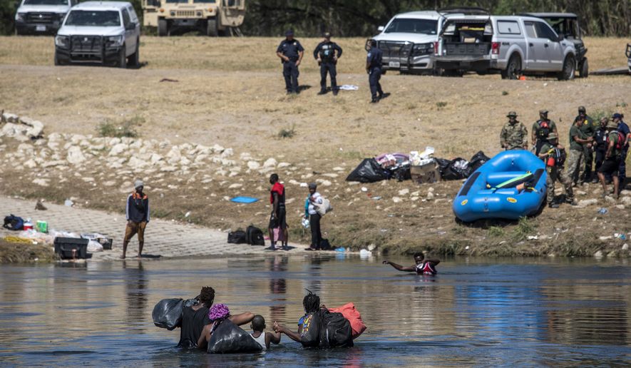 Migrants cross the Rio Grande toward Del Rio, Texas, from Ciudad Acuña, Mexico, Thursday, Sept. 23, 2021. (AP Photo/Felix Marquez) ** FILE **