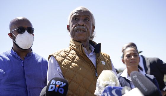 The Rev. Al Sharpton, center, speaks to reporters after touring an encampment of migrants, mostly from Haiti, along the Del Rio International Bridge, Thursday, Sept. 23, 2021, in Del Rio, Texas. (AP Photo/Julio Cortez)
