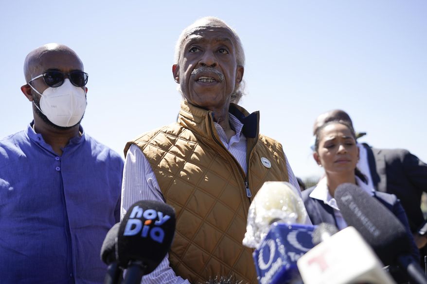 The Rev. Al Sharpton, center, speaks to reporters after touring an encampment of migrants, mostly from Haiti, along the Del Rio International Bridge, Thursday, Sept. 23, 2021, in Del Rio, Texas. (AP Photo/Julio Cortez)
