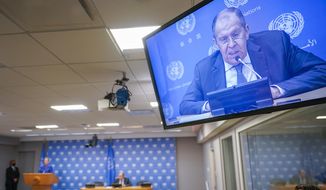 Russian Foreign Minister Sergey Lavrov is seen on a video screen as he speaks to reporters during a news conference during 76th session of the United Nations General Assembly, Saturday, Sept. 25, 2021, at United Nations headquarters. (AP Photo/Mary Altaffer)