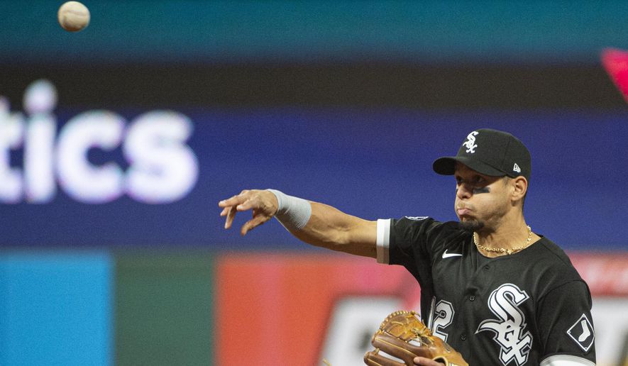 Chicago White Sox&#39;s Cesar Hernandez throws Cleveland Indians&#39; Amed Rosario out at first base during the third inning of a baseball game in Cleveland, Saturday, Sept. 25, 2021. (AP Photo/Phil Long) **FILE**