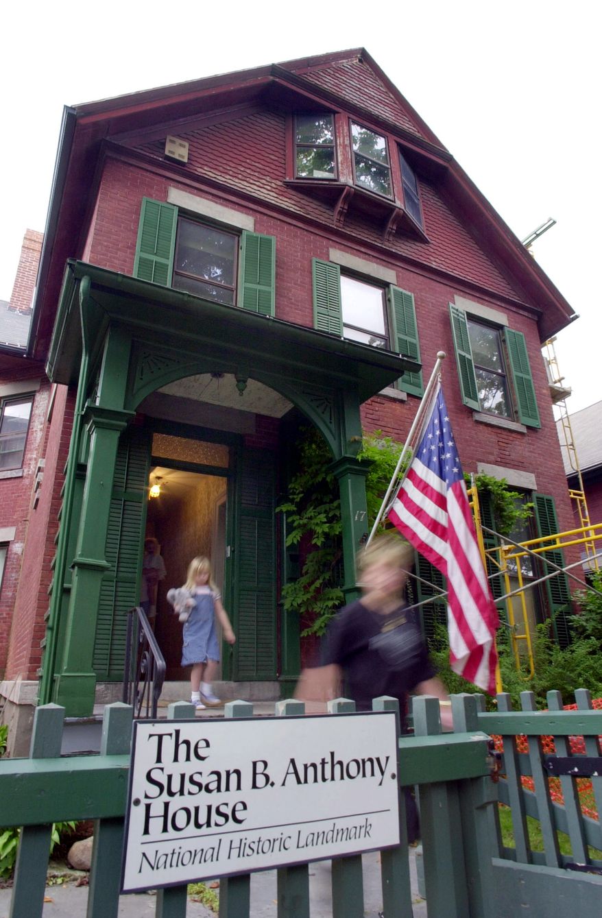 Tourists exit the Susan B. Anthony House after taking a tour of the house in Rochester, N.Y., July 28, 2004. The brick house at 17 Madison St. is a highlight in a trail of memorials and museums from New England south to Washington that extoll women's achievements in molding the nation. (AP Photo/David Duprey)