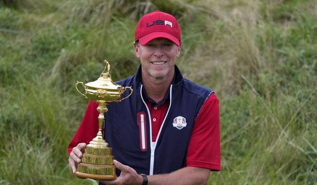 Team USA captain Steve Stricker poses with the trophy after the Ryder Cup matches at the Whistling Straits Golf Course Sunday, Sept. 26, 2021, in Sheboygan, Wis. (AP Photo/Ashley Landis) **FILE**