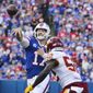 Buffalo Bills quarterback Josh Allen (17) throws a pass over Washington Football Team&#x27;s Jamin Davis (52) to Dawson Knox for a touchdown during the first half of an NFL football game Sunday, Sept. 26, 2021, in Orchard Park, N.Y. (AP Photo/Jeffrey T. Barnes)
