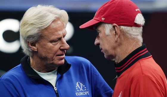 Team Europe&#39;s captain Bjorn Borg, left, chats with Team World&#39;s captain John McEnroe prior to Laver Cup tennis competition, Sunday, Sept. 26, 2021, in Boston. (AP Photo/Elise Amendola)