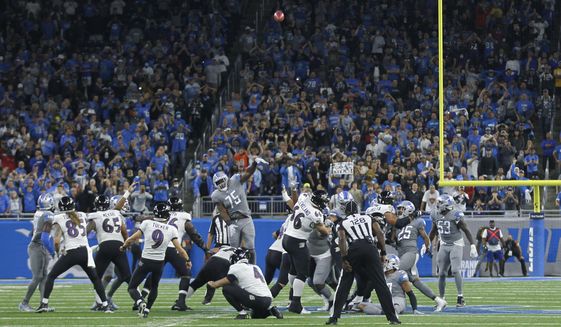 Baltimore Ravens kicker Justin Tucker (9) kicks a 66-yard field goal in the second half of an NFL football game against the Detroit Lions in Detroit, Sunday, Sept. 26, 2021. Baltimore won 19-17. (AP Photo/Tony Ding)