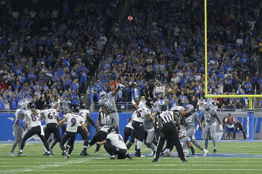 Baltimore Ravens kicker Justin Tucker (9) kicks a 66-yard field goal in the second half of an NFL football game against the Detroit Lions in Detroit, Sunday, Sept. 26, 2021. Baltimore won 19-17. (AP Photo/Tony Ding)