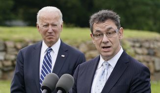 In this June 10, 2021, file photo President Joe Biden listens as Pfizer CEO Albert Bourla speaks about the Biden administration&#39;s global COVID-19 vaccination efforts ahead of the G-7 summit in St. Ives, England. Mr. Bourla said on Nov. 9 that people who deliberately spread false information about COVID-19 vaccines, often through sophisticated web operations, are “criminals.” (AP Photo/Patrick Semansky, File)  **FILE**