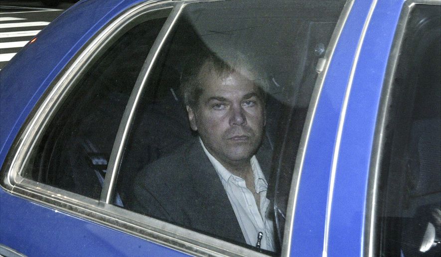 FILE - In this Nov. 18, 2003, file photo, John Hinckley Jr. arrives at U.S. District Court in Washington. Lawyers are scheduled to meet in federal court on Monday, Sept. 27, 2021 to discuss whether Hinckley Jr., the man who tried to assassinate President Ronald Reagan, should be freed from court-imposed restrictions including overseeing his medical care and keeping up with his computer passwords. (AP Photo/Evan Vucci, File)