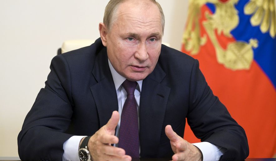 Russian President Vladimir Putin speaks during a meeting with leaders of the United Russia Party&#x27;s election list via video conference at the Novo-Ogaryovo residence outside Moscow, Russia, Monday, Sept. 27, 2021. (Alexei Druzhinin, Sputnik, Kremlin Pool Photo via AP)