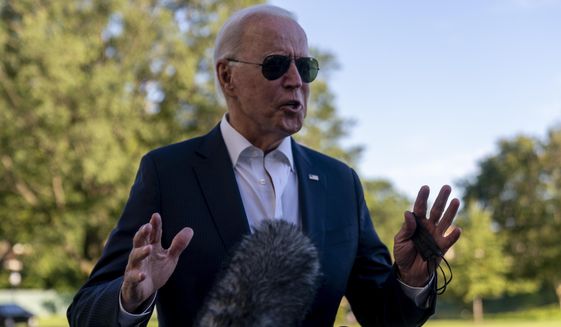 President Joe Biden stops to speak to members of the media as he arrives at the White House in Washington, Sunday, Sept. 26, 2021, after returning from a weekend at Camp David. (AP Photo/Andrew Harnik)