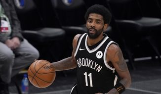 Brooklyn Nets guard Kyrie Irving handles the ball during an NBA basketball game against the Dallas Mavericks in Dallas, in this Thursday, May 6, 2021, file photo. Unable to attend the Brooklyn Nets&#39; media day, Kyrie Irving asked for privacy Monday when pressed about his vaccination status and availability for home games. (AP Photo/Tony Gutierrez) ** FILE **