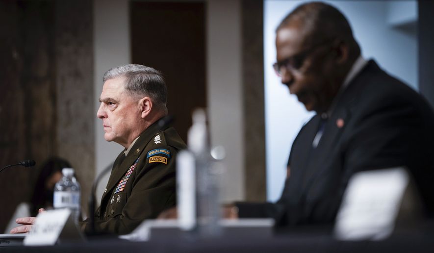 Chairman of the Joint Chiefs of Staff Gen. Mark Milley, left, and Defense Secretary Lloyd Austin testify during a Senate Armed Services Committee hearing on the conclusion of military operations in Afghanistan and plans for future counterterrorism operations, Tuesday, Sept. 28, 2021, on Capitol Hill in Washington.. (Sarahbeth Maney/The New York Times via AP, Pool)