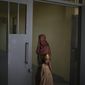 Razia and her 6-year-old daughter Alia, stand inside the women&#39;s section of the Pul-e-Charkhi prison in Kabul, Afghanistan, Thursday, Sept. 23, 2021. When the Taliban took control of a northern Afghan city of Pul-e-Kumri the operator of the only women&#39;s shelter ran away, abandoning 20 women in it. When the Taliban arrived at the shelter the women were given two choices: Return to their abusive families, or go with the Taliban, With nowhere to put the women, the Taliban took them to the abandoned women&#39;s section of Afghanistan&#39;s notorious Pul-e-Charkhi prison. (AP Photo/Felipe Dana)
