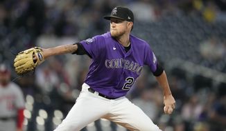 Colorado Rockies starting pitcher Kyle Freeland works against the Washington Nationals in the first inning of a baseball game Tuesday, Sept. 28, 2021, in Denver. (AP Photo/David Zalubowski)