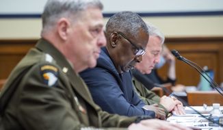 From left, Chairman of the Joint Chiefs of Staff Gen. Mark Milley, Defense Secretary Lloyd Austin and Gen. Kenneth McKenzie, commander of the United States Central Command testify during the House Armed Services Committee on the conclusion of military operations in Afghanistan and plans for future counterterrorism operations on Wednesday, Sept. 29, 2021, on Capitol Hill in Washington. (Rod Lamkey/Pool via AP)