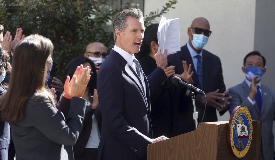 California Gov. Gavin Newsom speaks at a news conference to sign a number of housing bills at the Coliseum Connections apartment complex in Oakland, Calif., Tuesday, Sept. 28, 2021. Newsom signed seven new laws aimed at addressing the state&#39;s homeless crisis during an event in Los Angeles, on Wednesday, Sept. 29. (Aric Crabb/Bay Area News Group via AP)