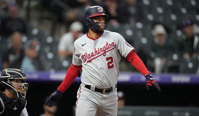 Washington Nationals&#x27; Luis Garcia follows the flight of his RBI-double off Colorado Rockies starting pitcher Peter Lambert in the third inning of a baseball game Wednesday, Sept. 29, 2021, in Denver. (AP Photo/David Zalubowski) **FILE**