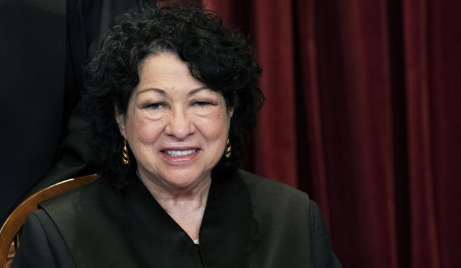 FILE - In this April 23, 2021, file photo Associate Justice Sonia Sotomayor sits during a group photo at the Supreme Court in Washington. Acknowledging the limits of her own influence on the law as a member of the Supreme Court&#x27;s liberal minority, Sotomayor on Wednesday, Sept. 29, encouraged citizens to work to change laws they may disagree with, like a recent Texas law that limits access to abortions. (Erin Schaff/The New York Times via AP, Pool, File)