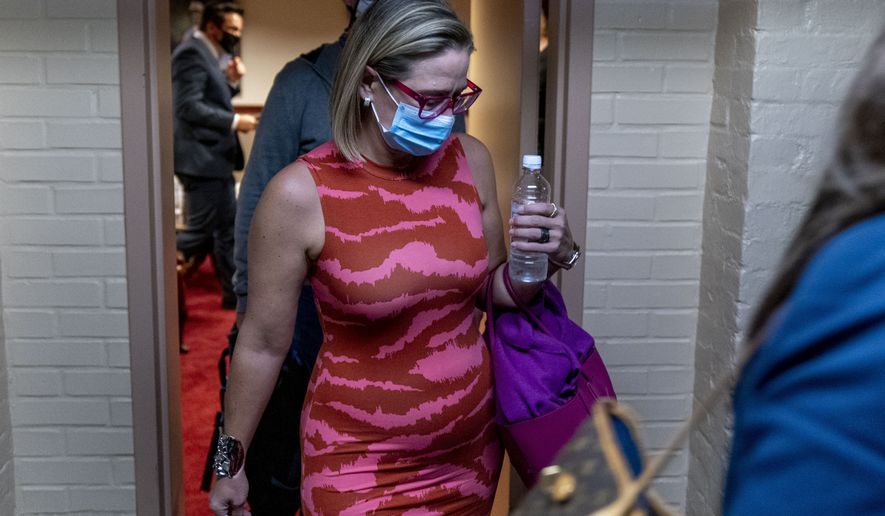 Sen. Kyrsten Sinema, D-Ariz., leaves a private meeting with Joe Manchin, D-W.Va., White House domestic policy adviser Susan Rice, Director of the National Economic Council Brian Deese, and other White House officials on Capitol Hill in Washington, Thursday, Sept. 30, 2021. (AP Photo/Andrew Harnik) ** FILE **