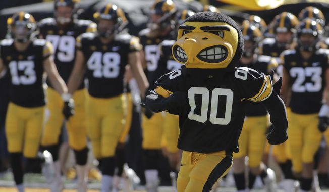 The Iowa Hawkeyes mascot runs onto the field, leading the team before the start of an NCAA college football game against Colorado State, Saturday, Sept. 25, 2021, in Iowa City, Iowa. (AP Photo/Ron Johnson)