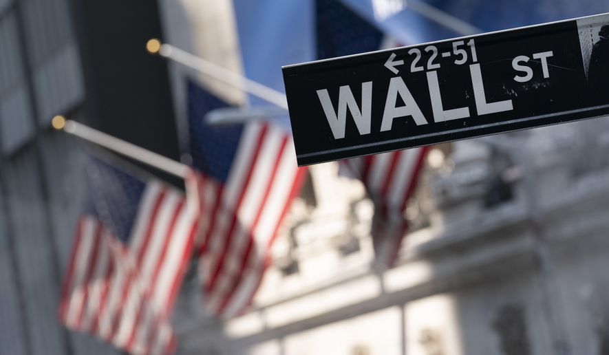 A sign for Wall Street hangs in front of the New York Stock Exchange, July 8, 2021.  Withthe close of the market on Sept. 30, 2021, the S&amp;P index had seen a 4.8% drop in the month of September, making it the worst month for the market since the beginning of the coronavirus pandemic in March 2020. (AP Photo/Mark Lennihan, file) **FILE**