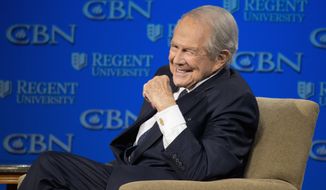 In this Feb. 24, 2016, photo, Rev. Pat Robertson listens as Republican presidential candidate Donald Trump speaks at Regent University in Virginia Beach, Va. The Christian Broadcasting Network says Pat Robertson is stepping down as host of the long-running daily television show the 700 Club. Robertson said in a statement that his last time hosting the network&#39;s flagship program was Friday, Oct. 1, 2021. (AP Photo/Steve Helber) **FILE**