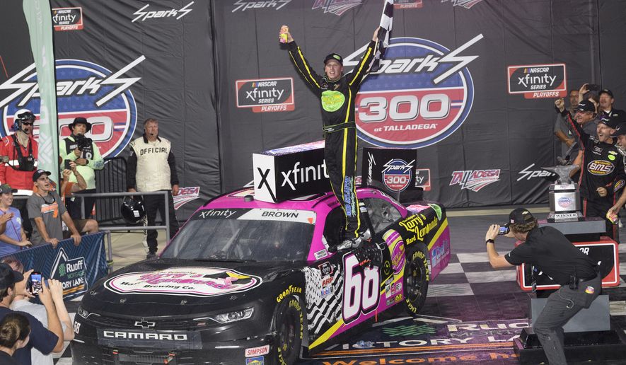 Brandon Brown celebrates in Victory Lane after winning a NASCAR Xfinity Series auto race Saturday, Oct. 2, 2021, in Talladega, Ala. (AP Photo/John Amis)