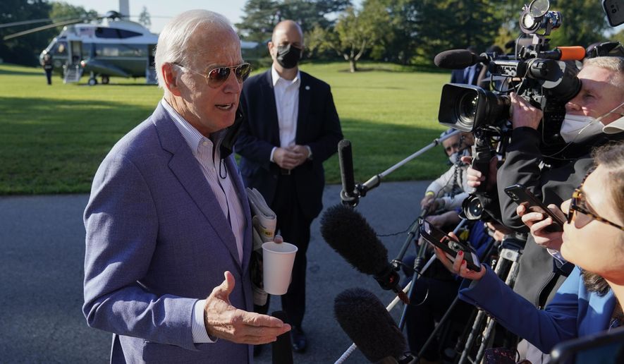 President Joe Biden speaks with members of the press before boarding Marine One on the South Lawn of the White House, Saturday, Oct. 2, 2021, in Washington. (AP Photo/Patrick Semansky) ** FILE **