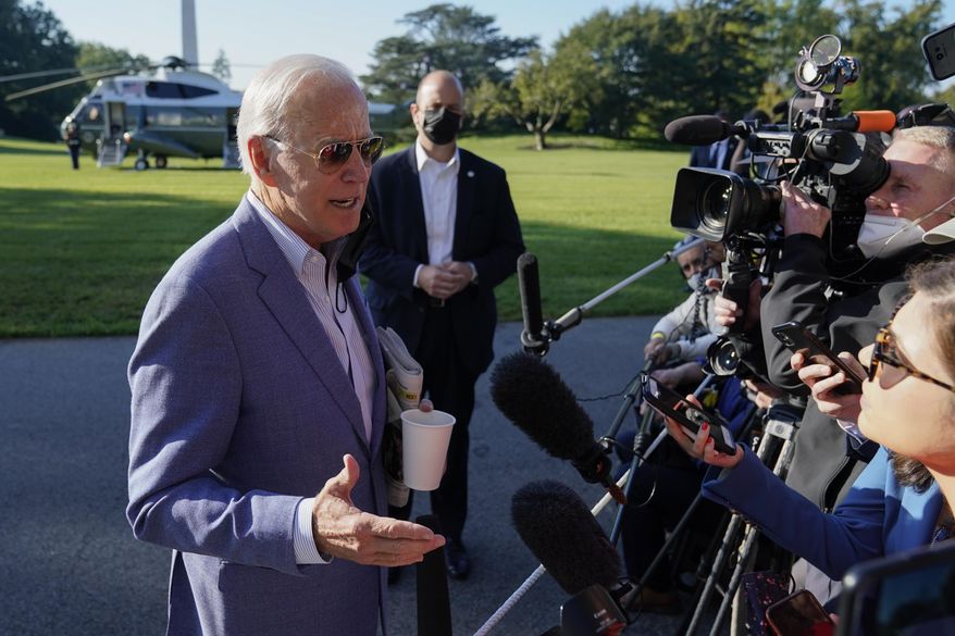 President Joe Biden speaks with members of the press before boarding Marine One on the South Lawn of the White House, Saturday, Oct. 2, 2021, in Washington. (AP Photo/Patrick Semansky) ** FILE **