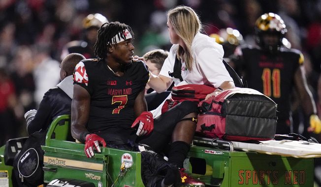 Maryland wide receiver Dontay Demus Jr. is carted off the field during the first half of an NCAA college football game against Iowa, Friday, Oct. 1, 2021, in College Park, Md. (AP Photo/Julio Cortez) **FILE**