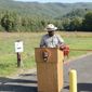 Great Smoky Mountains National Park Superintendent Cassius Cash makes opening remarks prior to the ribbon cutting at the newly opened accessible trail to the John Oliver Cabin in Cades Cove, Tuesday, Sept. 28, 2021, in Great Smoky Mountain National Park, Tennessee. (Scott Keller/The Daily Times via AP)