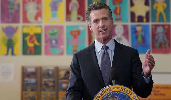 Gov. Gavin Newsom speaks at a news conference at James Denman Middle School in San Francisco, Friday, Oct. 1, 2021. California has announced the nation&#x27;s first coronavirus vaccine mandate for schoolchildren.  Newsom said Friday that the mandate won&#x27;t take effect until the COVID-19 vaccine has received final approval from the U.S. government for various grade levels.   (AP Photo/Jeff Chiu)