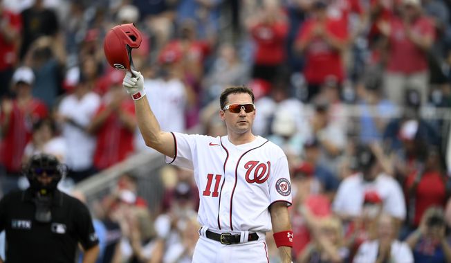 Washington Nationals&#x27; Ryan Zimmerman doffs his batting helmet to the crowd before batting during the second inning of a baseball game against the Boston Red Sox, Sunday, Oct. 3, 2021, in Washington. (AP Photo/Nick Wass) ** FILE**