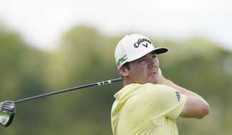 Sam Burns watches his drive from the second tee during the final round of the Sanderson Farms Championship golf tournament in Jackson, Miss., Sunday, Oct. 3, 2021. (AP Photo/Rogelio V. Solis)