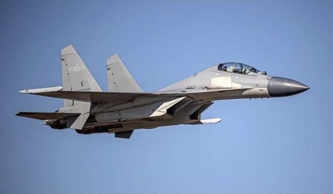 In this undated file photo released by the Taiwan Ministry of Defense, a Chinese PLA J-16 fighter jet flies in an undisclosed location. China flew more than 30 military planes toward Taiwan on Saturday, Oct. 2, 2021, the second large display of force in as many days. (Taiwan Ministry of Defense via AP, File)