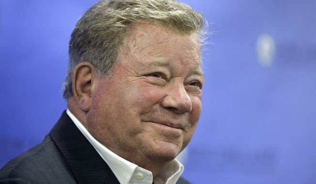 In this May 6, 2018, file photo, actor William Shatner takes questions from reporters after delivering the commencement address at New England Institute of Technology graduation ceremonies, in Providence, R.I. Star Treks Captain Kirk is rocketing into space this month boldly going where no other sci-fi actors have gone. (AP Photo/Steven Senne, File)