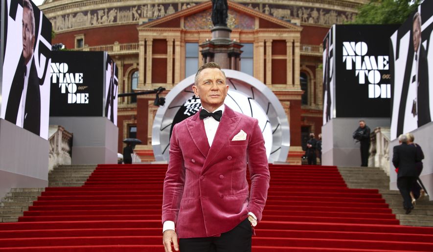 Daniel Craig poses for photographers upon arrival for the World premiere of the new film from the James Bond franchise 'No Time To Die', in London Tuesday, Sept. 28, 2021. (Photo by Joel C Ryan/Invision/AP)