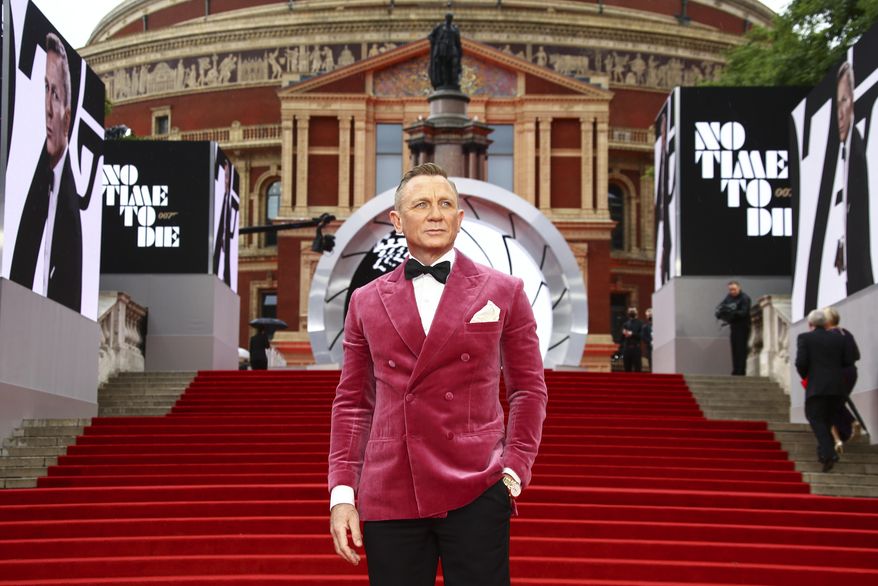 Daniel Craig poses for photographers upon arrival for the World premiere of the new film from the James Bond franchise 'No Time To Die', in London Tuesday, Sept. 28, 2021. (Photo by Joel C Ryan/Invision/AP)