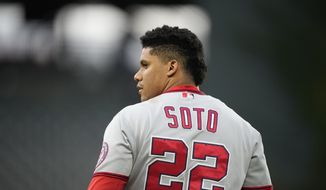 Washington Nationals&#39; Juan Soto heads to his position in right field after grounding into a double play to end the top of the sixth inning of a baseball game against the Colorado Rockies Wednesday, Sept. 29, 2021, in Denver. (AP Photo/David Zalubowski) **FILE**