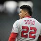Washington Nationals&#39; Juan Soto heads to his position in right field after grounding into a double play to end the top of the sixth inning of a baseball game against the Colorado Rockies Wednesday, Sept. 29, 2021, in Denver. (AP Photo/David Zalubowski) **FILE**