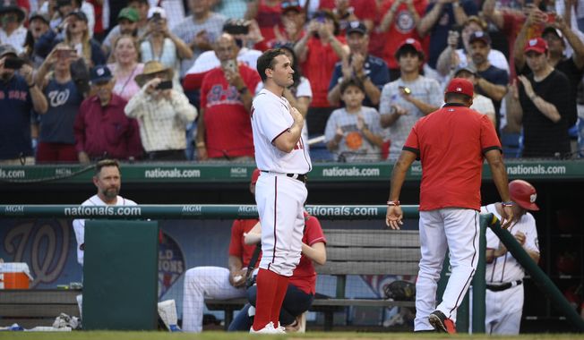 Washington Nationals&#x27; Ryan Zimmerman gestures to the crowd after he came out of the game before the eighth inning of a baseball game against the Boston Red Sox, Sunday, Oct. 3, 2021, in Washington. The Red Sox won 7-5. (AP Photo/Nick Wass) **FILE**