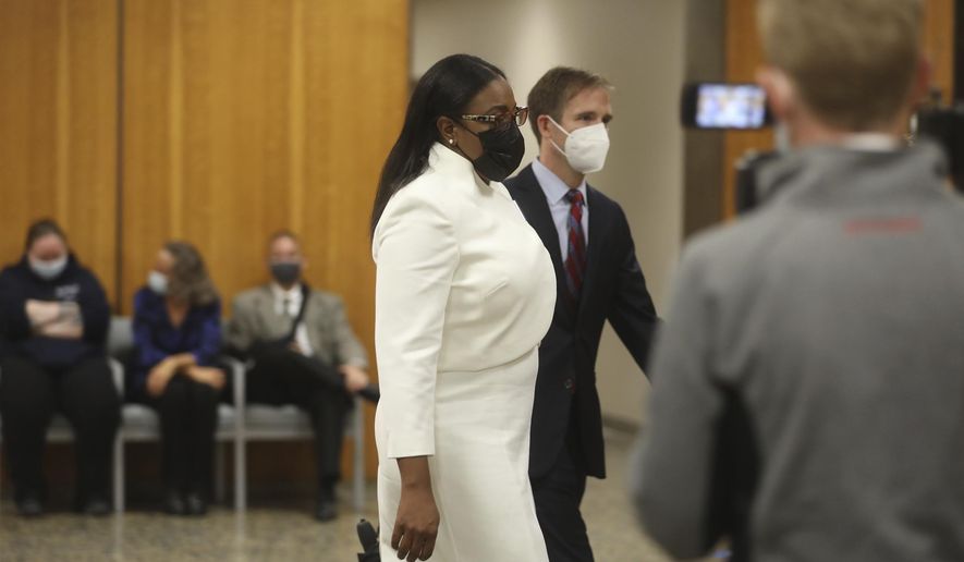 Rochester Mayor Lovely Warren walks towards the courtroom for the start of her trial in Rochester, N.Y., on Monday, Oct. 4, 2021. Warren and two political campaign associates, Rosalind Brooks-Harris and Albert Jones Jr., are charged with breaking campaign finance rules during her 2017 reelection campaign. (Democrat &amp;amp; Chronicle via AP)