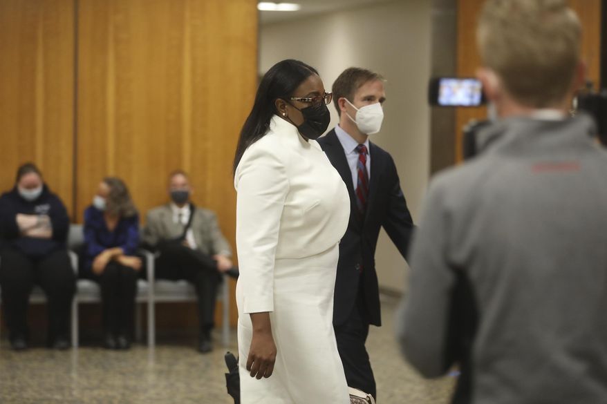 Rochester Mayor Lovely Warren walks towards the courtroom for the start of her trial in Rochester, N.Y., on Monday, Oct. 4, 2021. Warren and two political campaign associates, Rosalind Brooks-Harris and Albert Jones Jr., are charged with breaking campaign finance rules during her 2017 reelection campaign. (Democrat &amp;amp; Chronicle via AP)