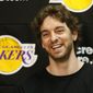 In this April 30, 2013 file photo, Los Angeles Lakers power forward Pau Gasol smiles while talking to reporters during an NBA basketball news conference in El Segundo, Calif. Pau Gasol announced his retirement from basketball on Tuesday,  Oct. 5, 2021, ending a career that lasted more than two decades and earned him two NBA titles and a world championship gold with Spain&#39;s national team. (AP Photo/Damian Dovarganes, File) **FILE**